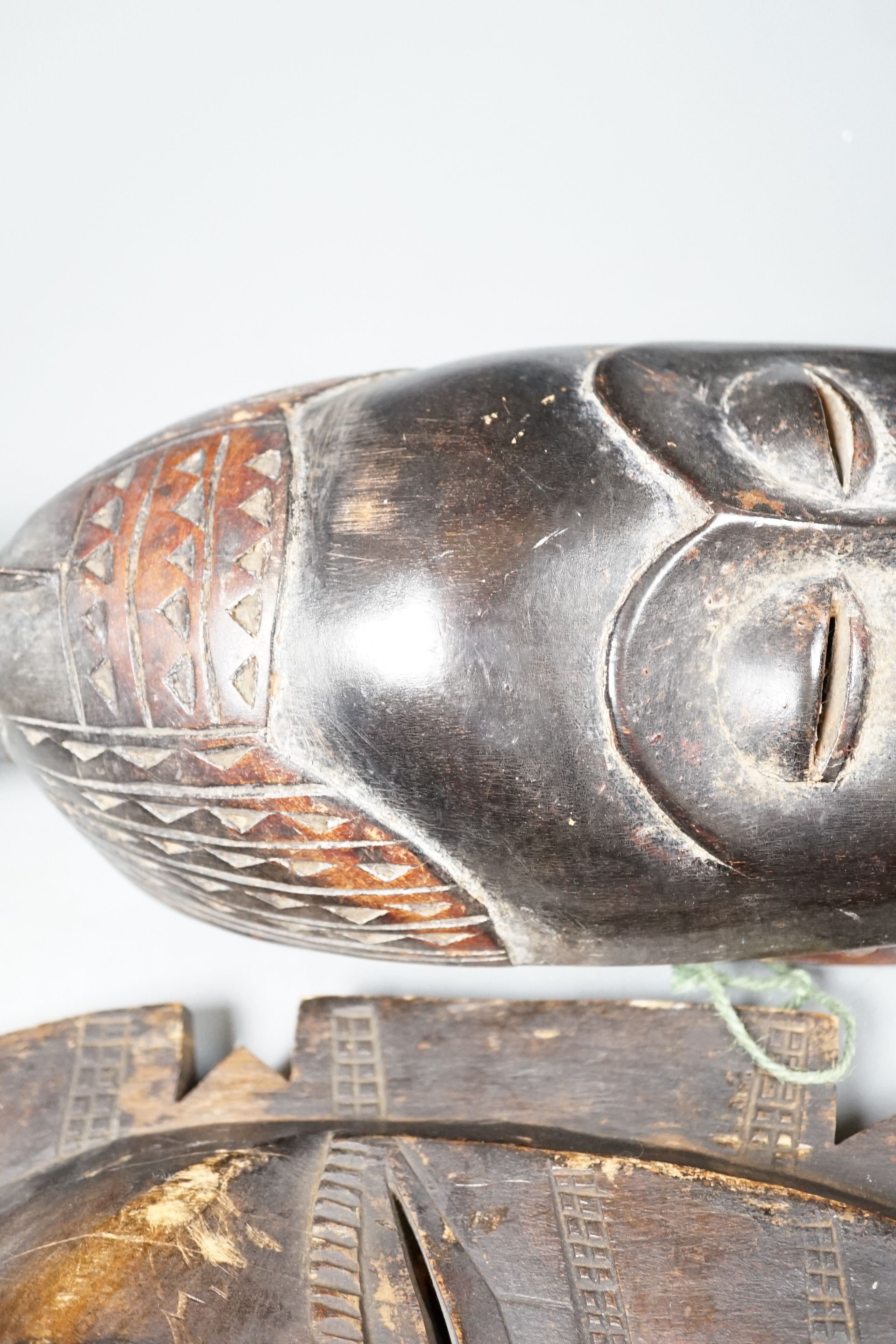Two African carved wood masks; Senufo and Baule 65cm